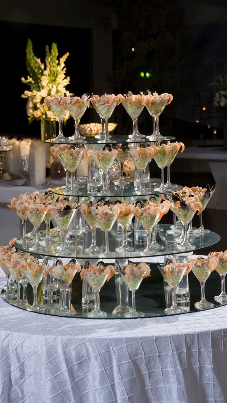 A tiered glass stand of small serves