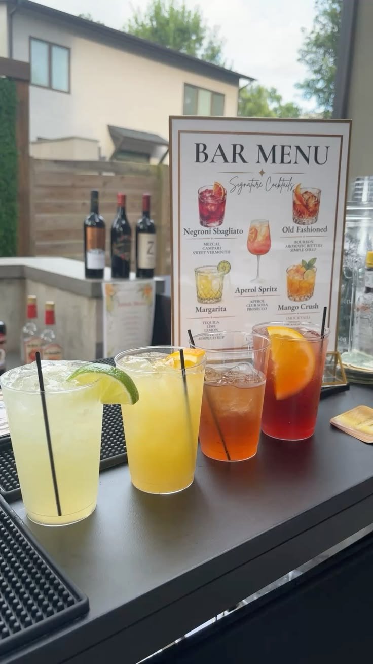Cocktails lined up on a bar counter