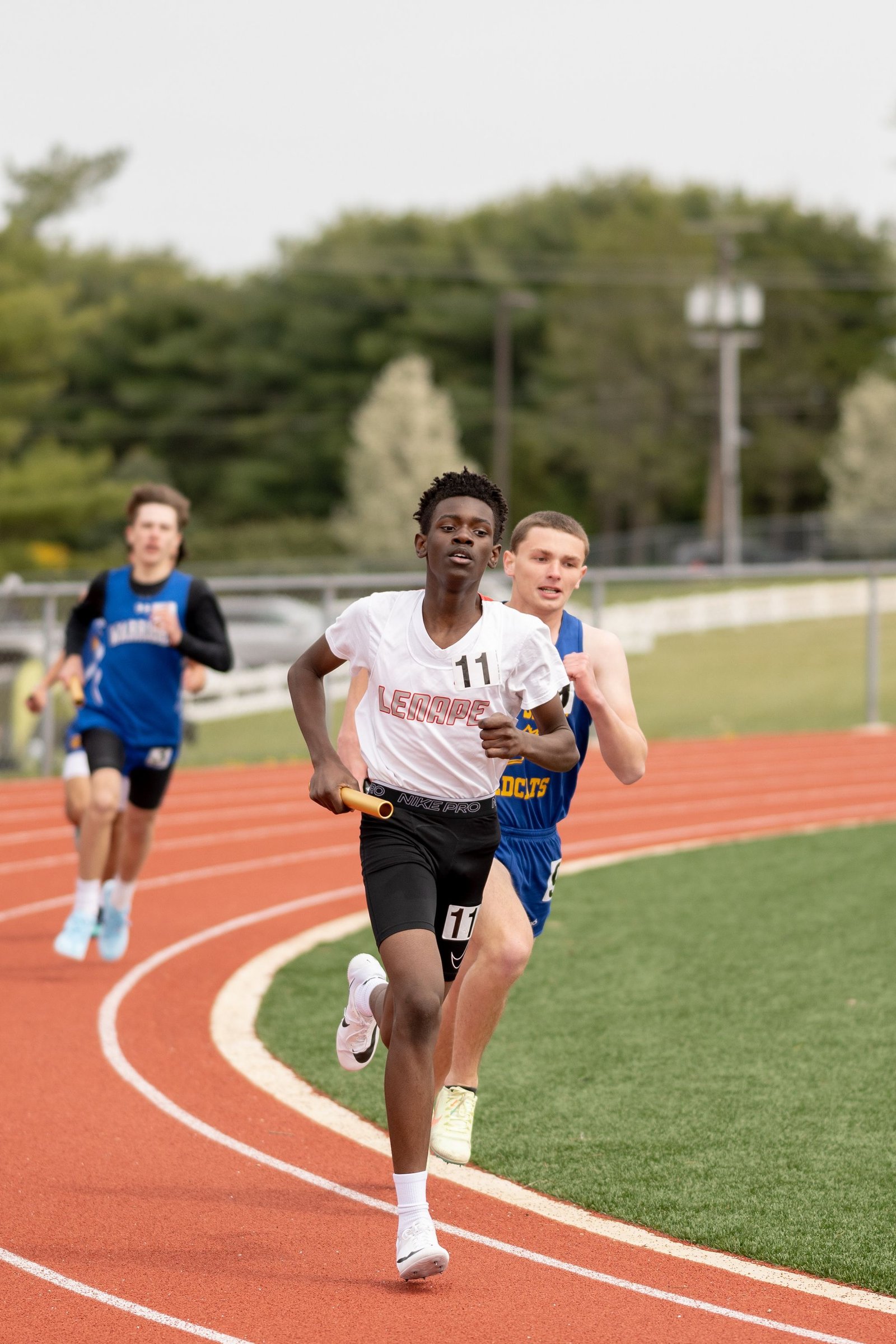 Relay runners on a track