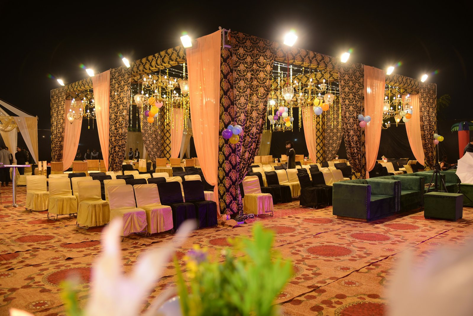 Night wedding tent under strings of lights